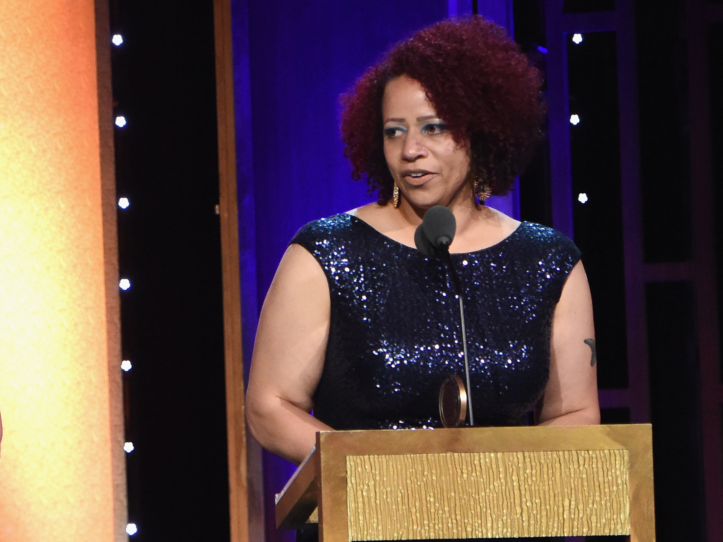 caption: Journalist Nikole Hannah-Jones accepts a Peabody Award in May 2016.