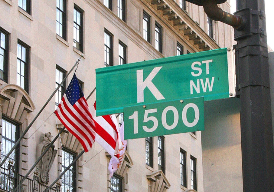 caption: A sign showing K Street is shown in Washington,D.C. A stone's throw from the White House, K Street is an alternative corridor of power in US politics, packed with thick carpeted offices and lobbyists with even deeper pockets.(Karen Bleier/AFP via Getty Images)