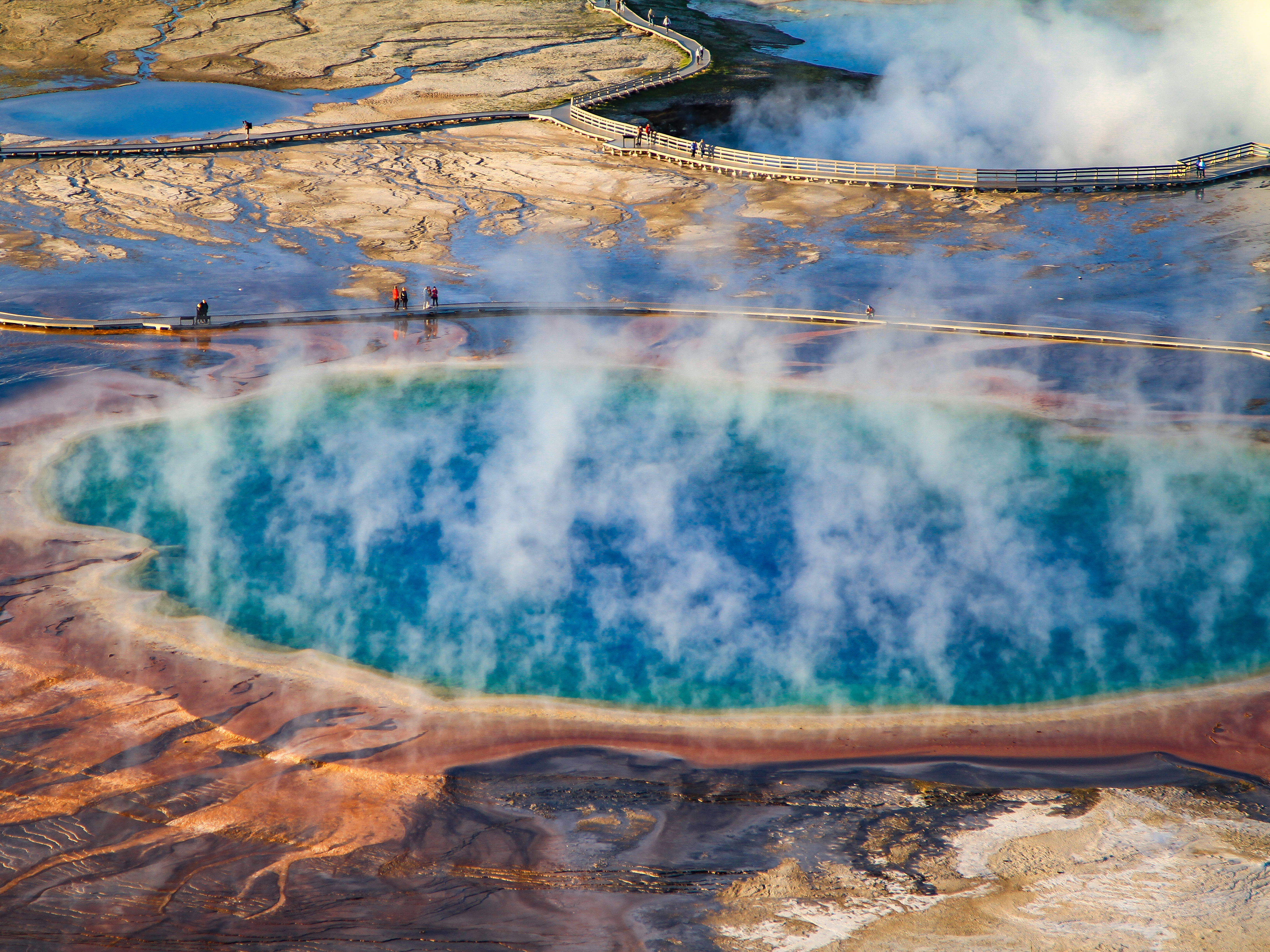 caption: Grand Prismatic Spring in Yellowstone National Park. Yellowstone is America's original national park and hosts more than 4 million visitors annually.