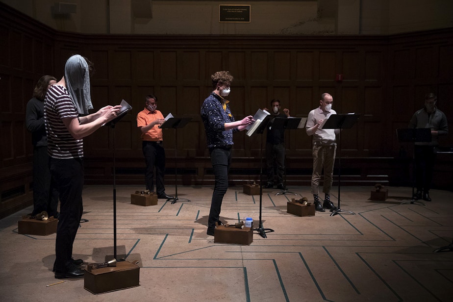 caption: Members of the Compline Choir rehearse while wearing masks ahead of a live-streamed Easter service on Sunday, April 12, 2020, at St. Mark's Episcopal Cathedral in the Capitol Hill neighborhood of Seattle. 