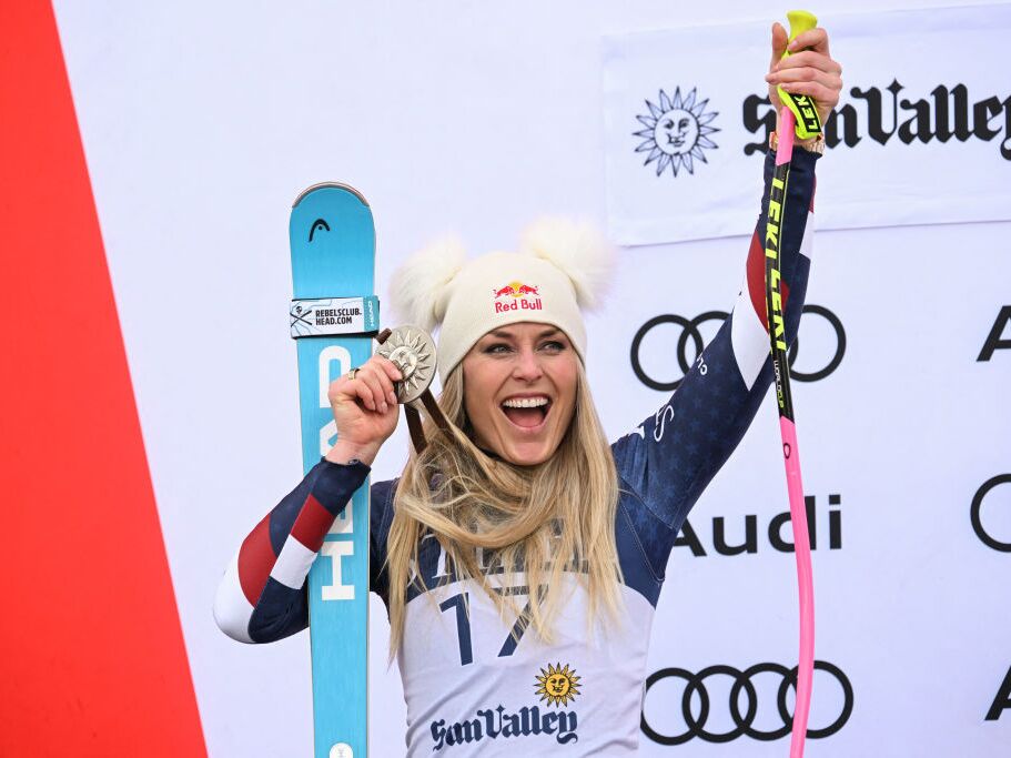 caption: USA's Lindsey Vonn poses with her second-place medal on the podium for the women's Super-G event at the Audi FIS Ski World Cup Sun Valley Finals in Sun Valley, Idaho on March 23.