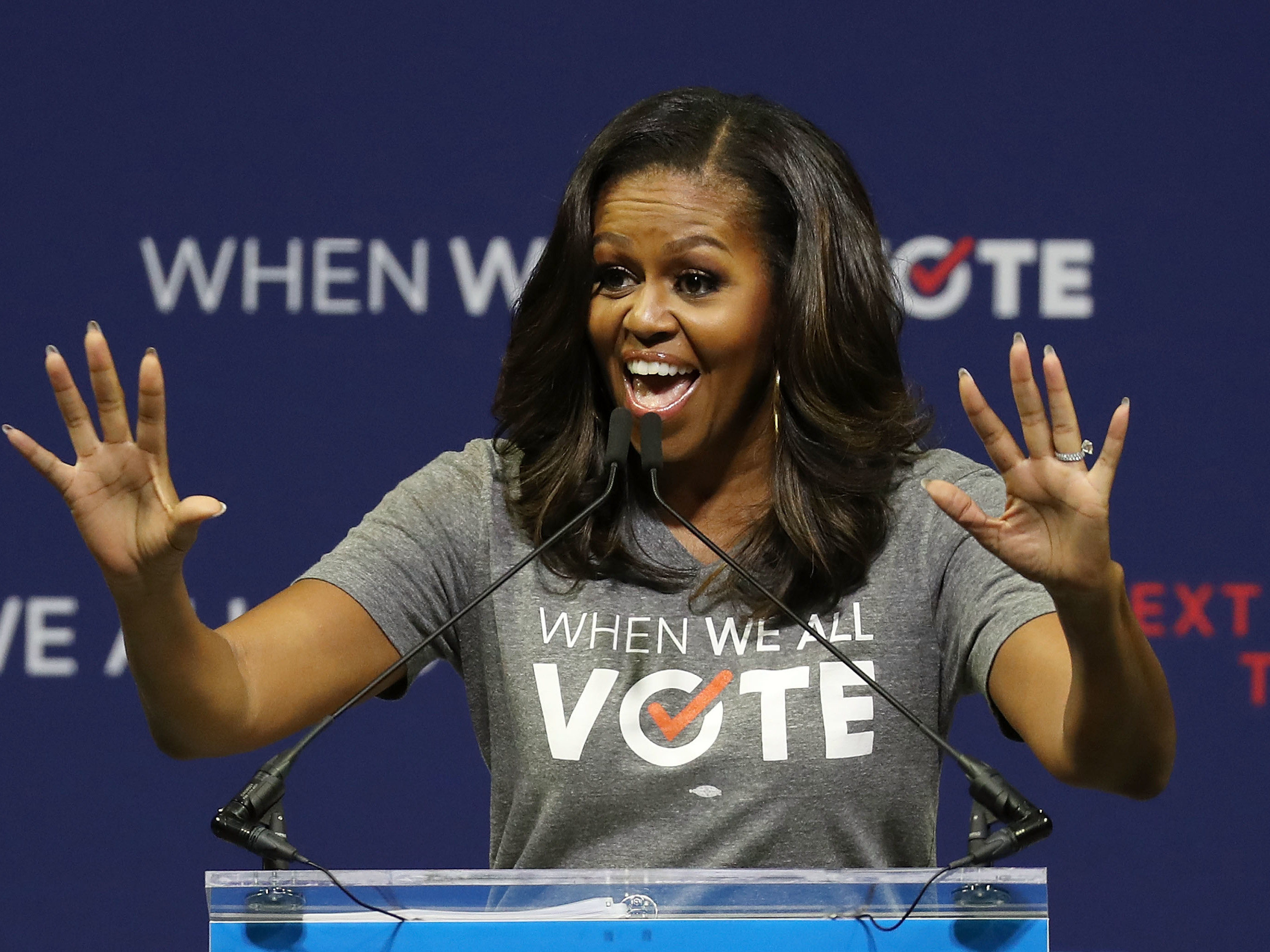caption: Former first lady Michelle Obama, seen here at a rally in 2018, is the founder of When We All Vote, an organization that aims to help people register and vote.