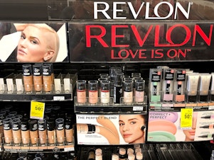 caption: Revlon is filing for Chapter 11 bankruptcy amid heavy debt, competition from newer competitors and supply chain fluctuations.