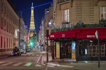 caption: Paris is under nightly curfew, starting at 9, to curb the spread of rising coronavirus cases.