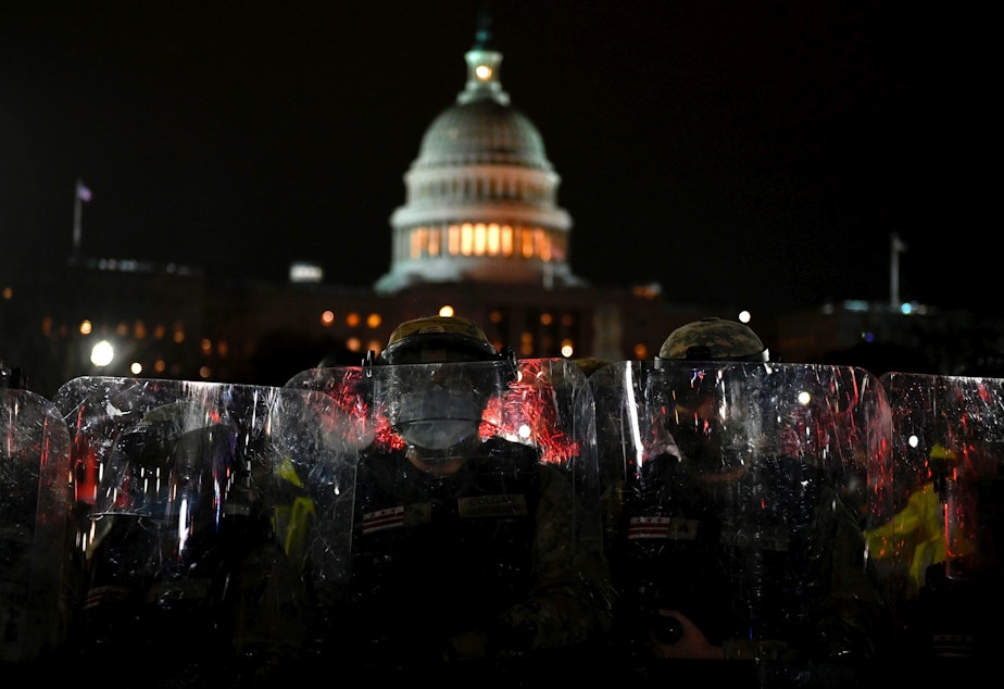 caption: Members of the D.C. National Guard are deployed outside of the U.S. Capitol on Wednesday evening. Supporters of President Trump stormed a session of Congress earlier Wednesday.