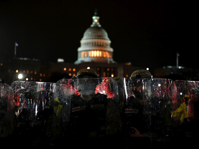 caption: Members of the D.C. National Guard are deployed outside of the U.S. Capitol on Wednesday evening. Supporters of President Trump stormed a session of Congress earlier Wednesday.