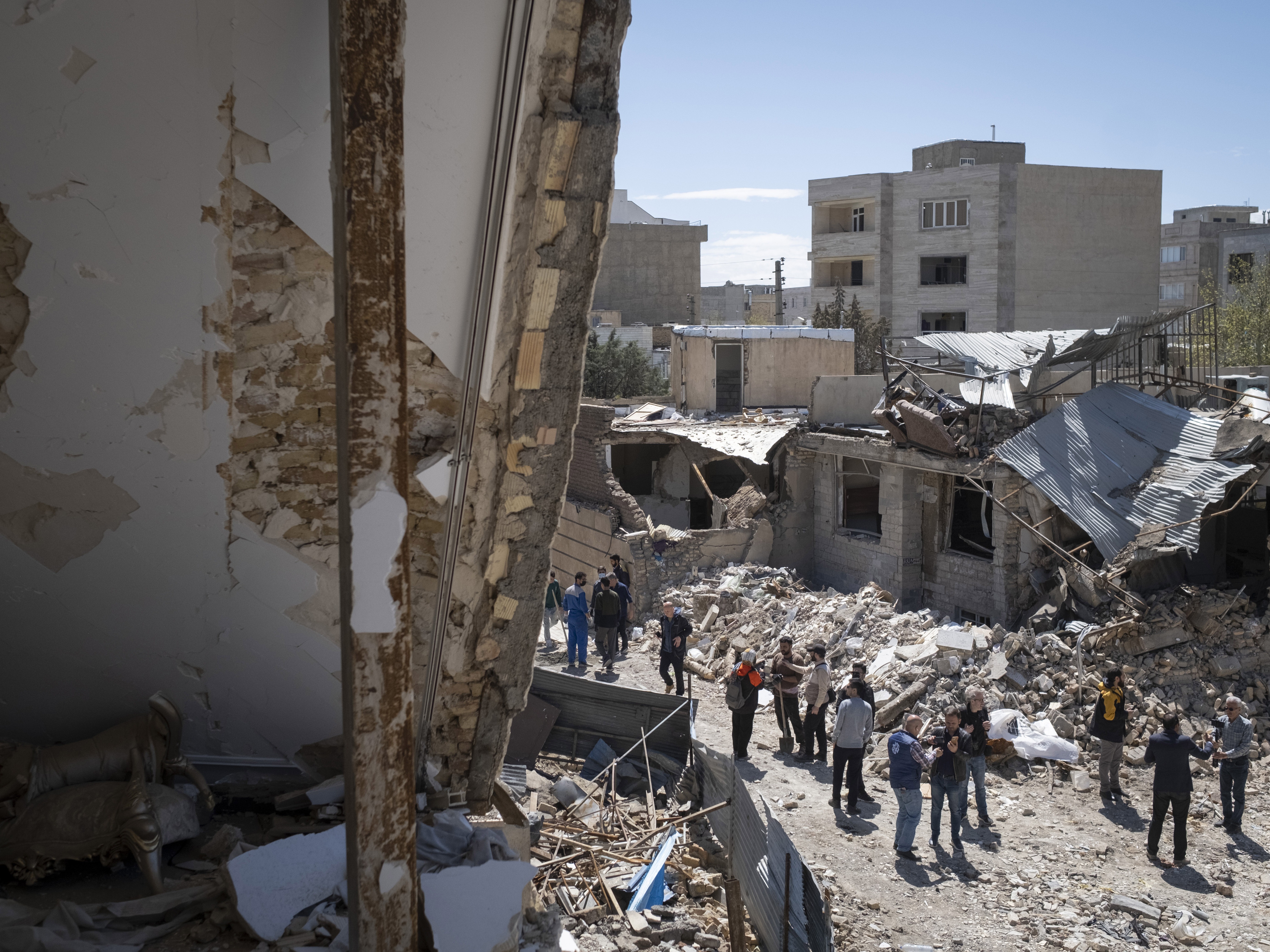 caption: A view of a residential area affected during the U.S.-Israeli military operations in the city of Karaj, in Alborz province, several miles west of Tehran, Iran, on Friday. The area was struck on March 9.