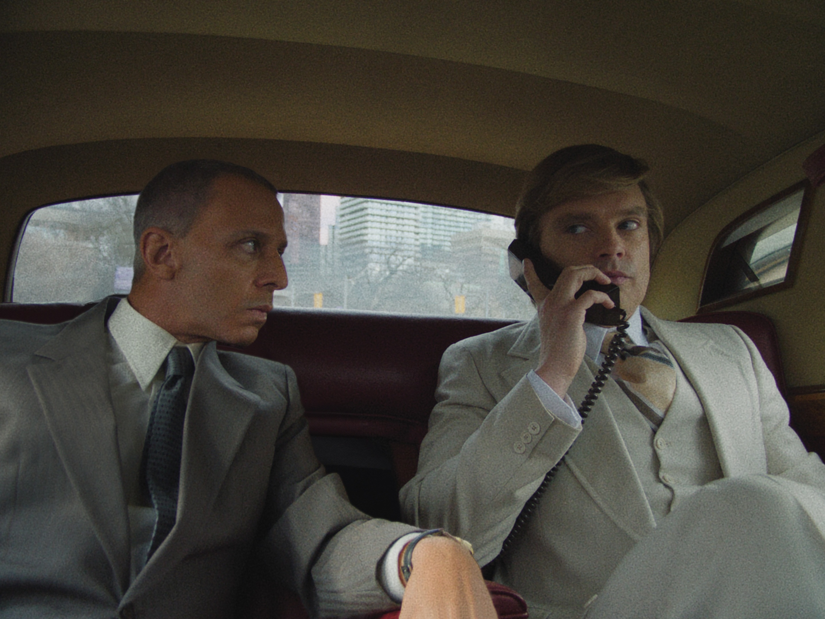caption: Jeremy Strong (left) as Roy Cohn and Sebastian Stan (right) as Donald Trump appear in Ali Abbasi's film <em>The Apprentice</em>.