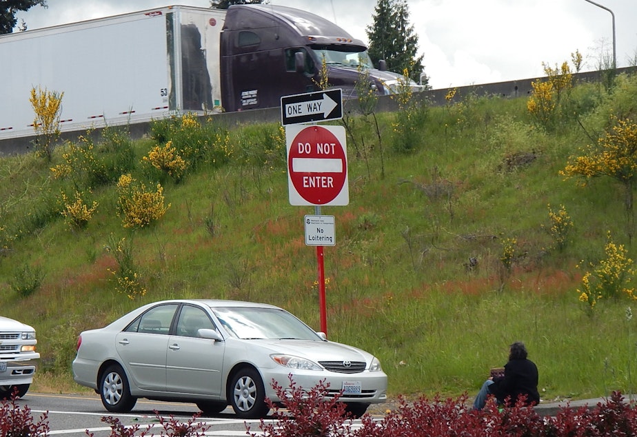 caption: A panhandler in Auburn, Washington.
