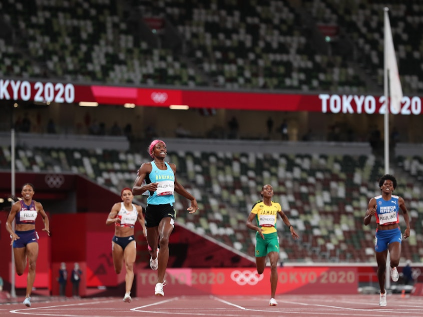 caption: Shaunae Miller-Uibo of the Bahamas wins the gold medal during the women's 400-meters during the Tokyo Olympic Games in August 2021.