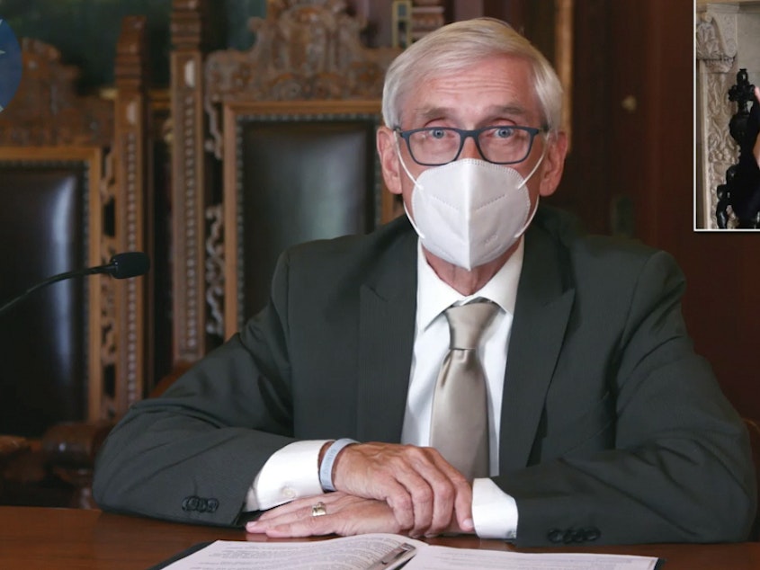 caption: A Wisconsin judge upheld Gov. Tony Evers' order mandating that face coverings be worn in enclosed spaces statewide, save for a few exceptions. A conservative legal group challenged the measure, arguing that Evers overstepped his authority in issuing successive emergency orders.