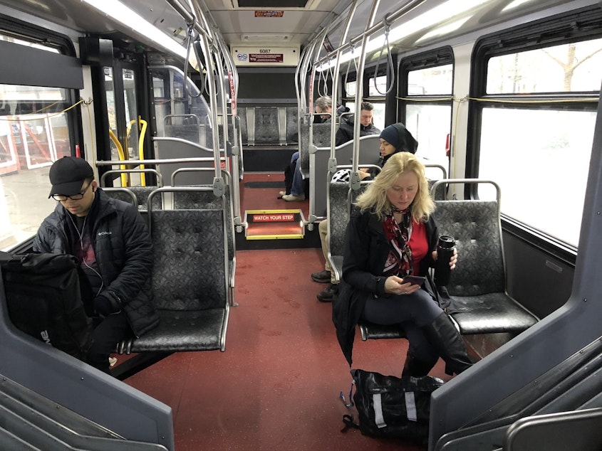 caption: Many buses on 3rd Avenue through Seattle are not full. But the bus-only street carries more buses than any other street in North America.