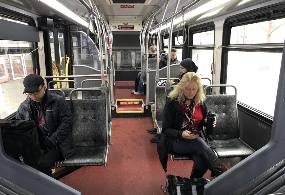 caption: Many buses on 3rd Avenue through Seattle are not full. But the bus-only street carries more buses than any other street in North America.