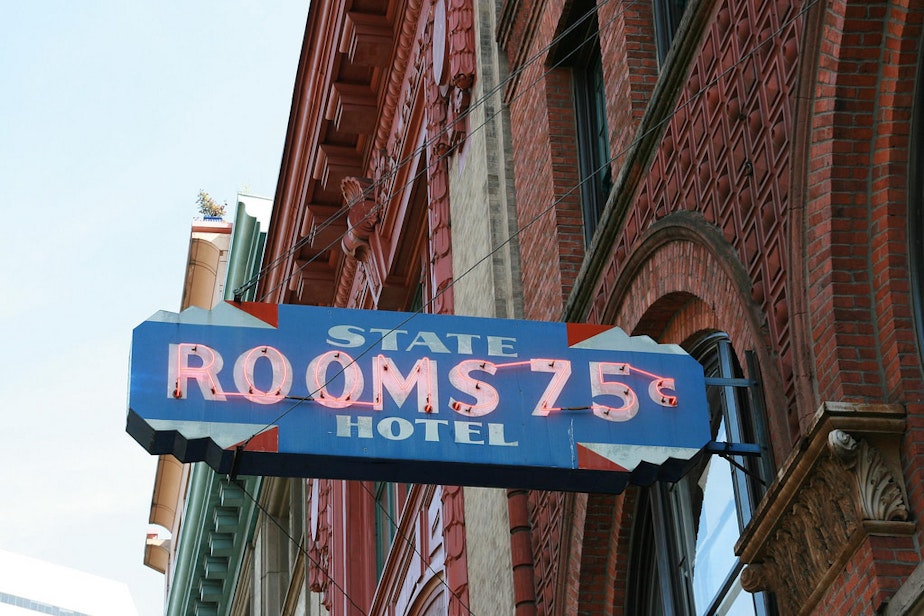 caption: A 1960s sign from an old flophouse in Pioneer Square in Seattle.