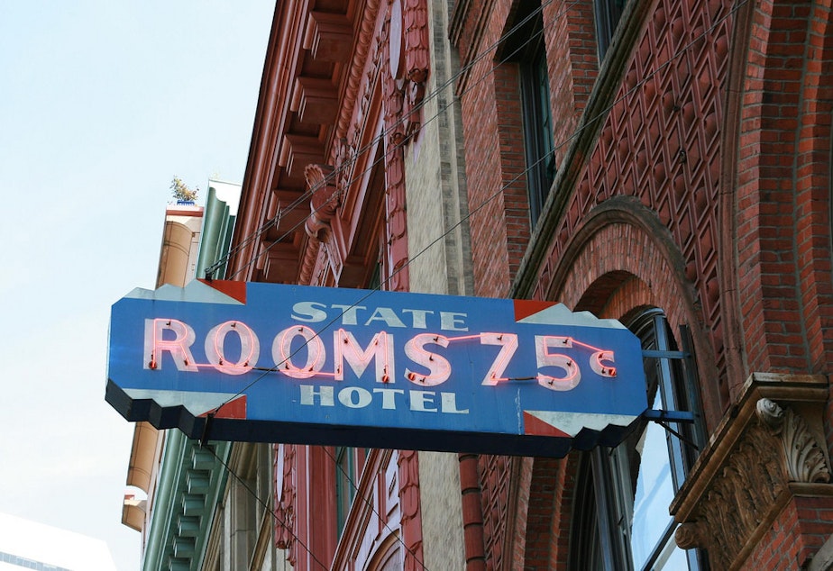 caption: A 1960s sign from an old flophouse in Pioneer Square in Seattle.