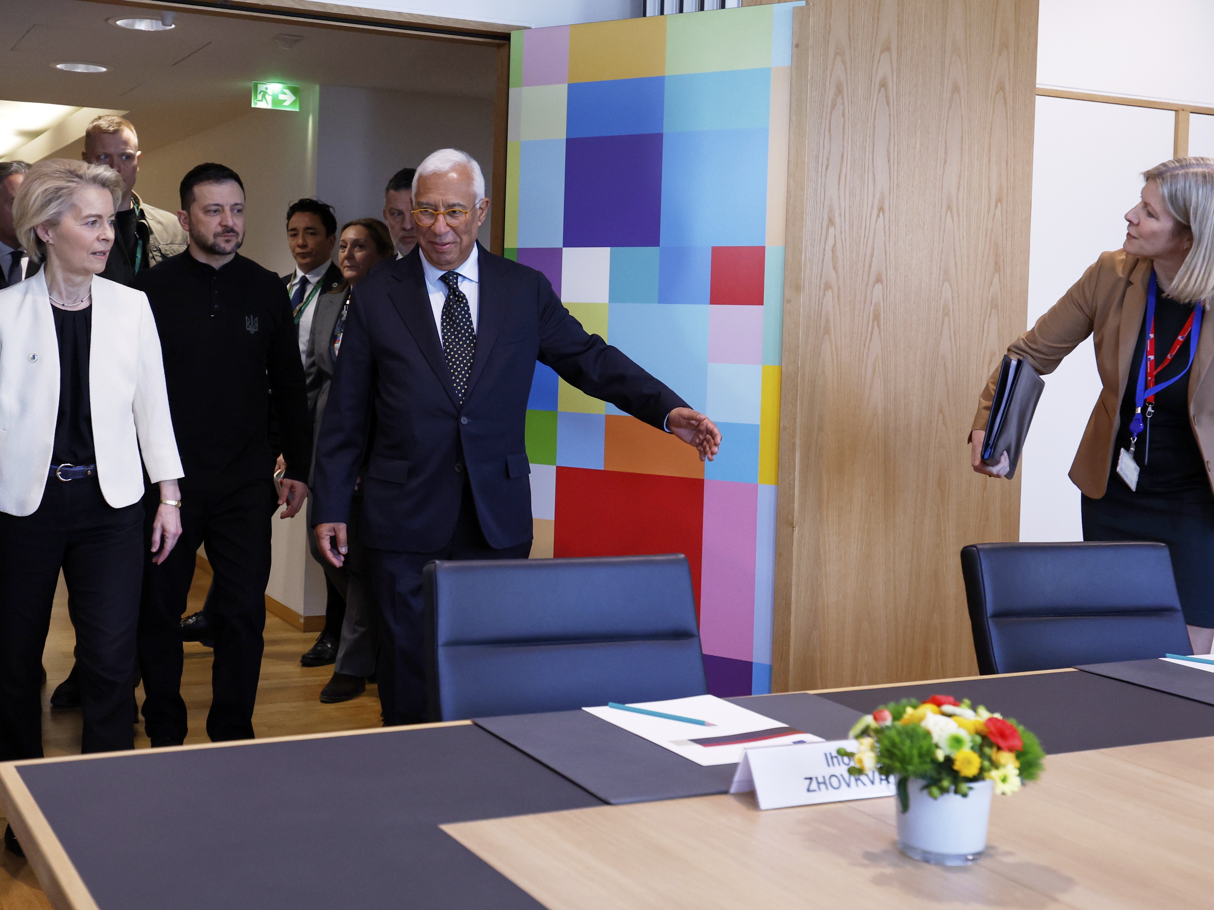 caption: European Commission President Ursula von der Leyen, left, Ukraine President Volodymyr Zelenskyy, center, and European Council President Antonio Costa, center right, and  arrive for a round table meeting at an EU Summit in Brussels on Thursday.