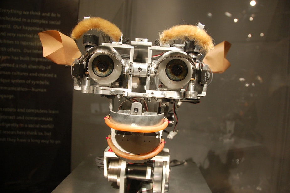 caption: Kismet, the artificial intelligence robot at the MIT museum, can interact and smile at people.
