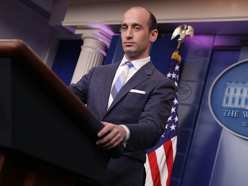 caption: America First Legal, an organization launched by former Donald Trump aide Stephen Miller (seen here at the White House in 2017), has been funding political ads that accuse the Biden administration of "pushing radical gender experiments on children."