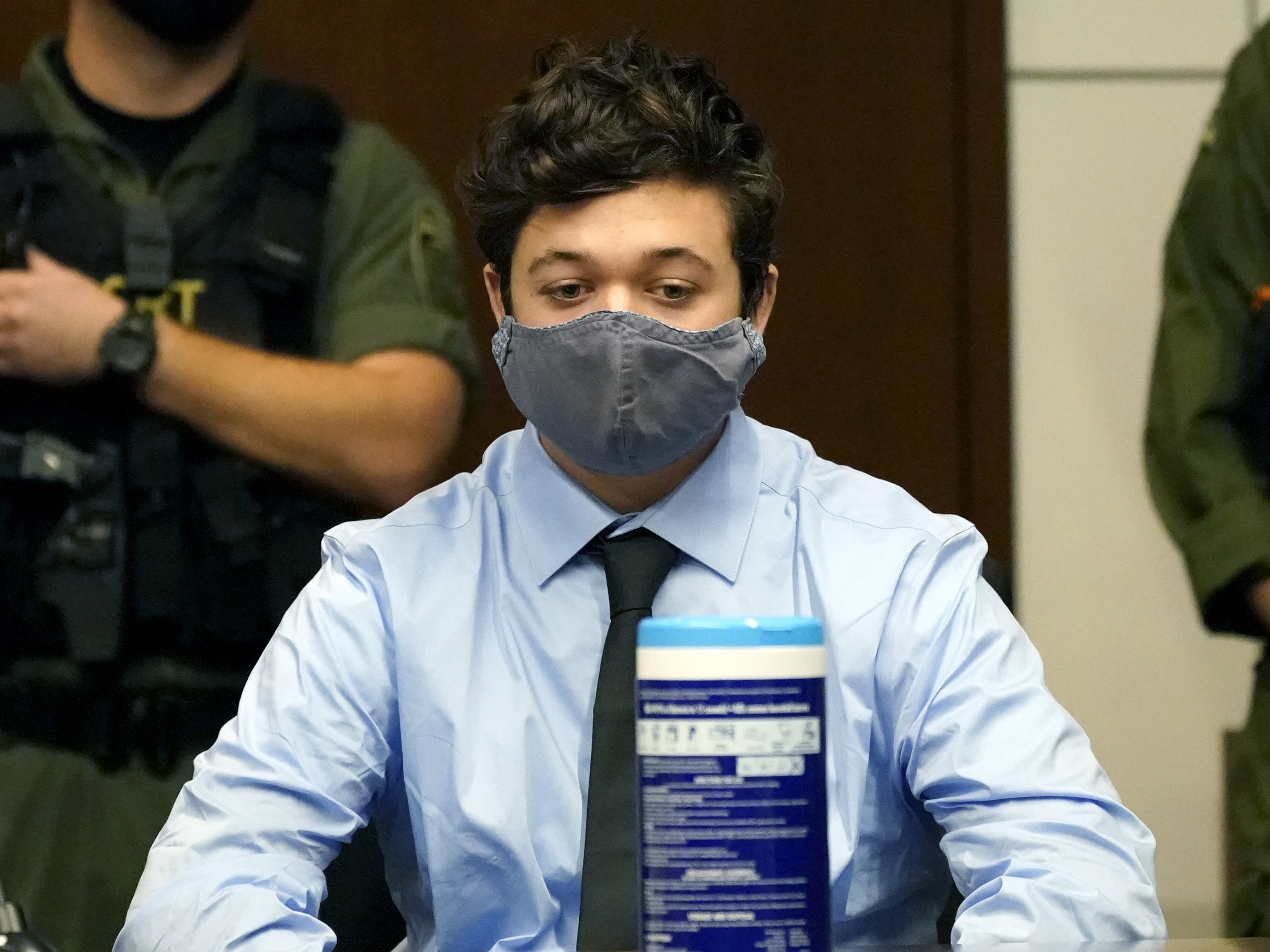 caption: A Wisconsin court commissioner said Kyle Rittenhouse, pictured during a hearing on Friday, poses a flight risk.