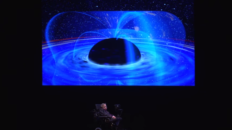 caption: Stephen Hawking presenting at the Pacific Science Center in 2012.