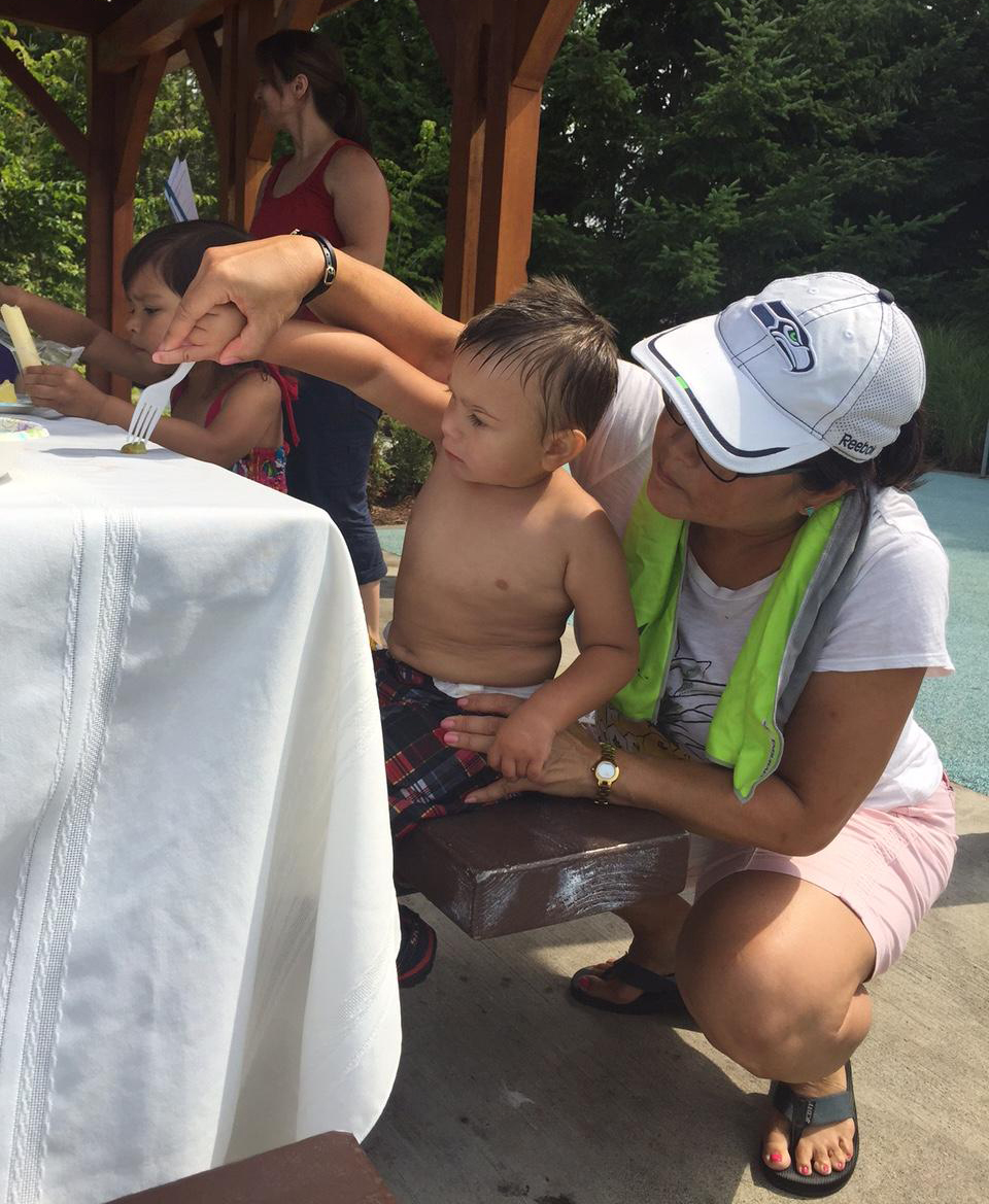caption: Two-year-old Mason Rueber practices forking a grape with a Kindering special educator Wendy Olsen. The Best Starts for Kids levy would fund programs that identify and address developmental delays early in children's lives.