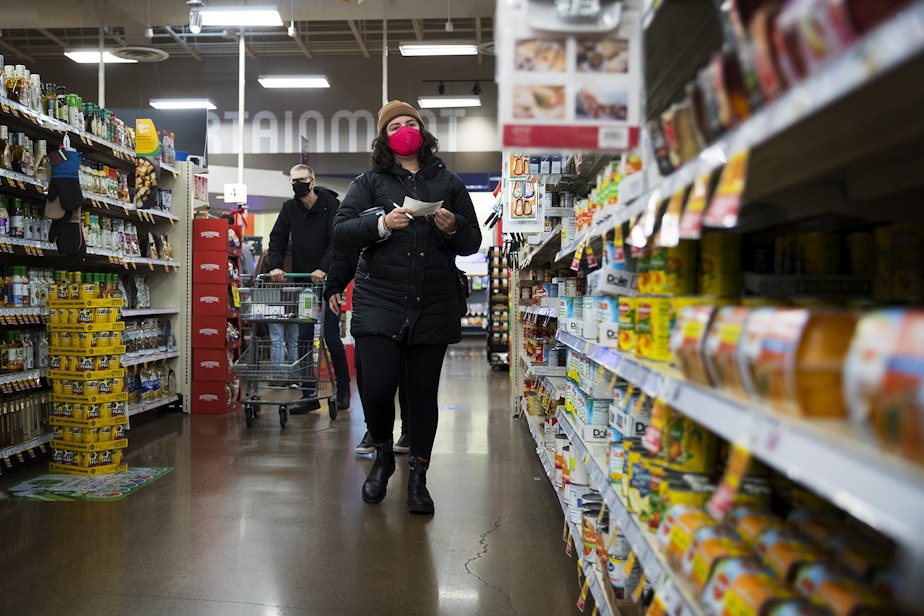 caption: Melissa grocery shops at Fred Meyer on Monday, November 16, 2020, on Northwest 45th Street in Seattle. New statewide restrictions were announced by Gov. Jay Inslee on Sunday to curb the rapid spread of Covid-19. 