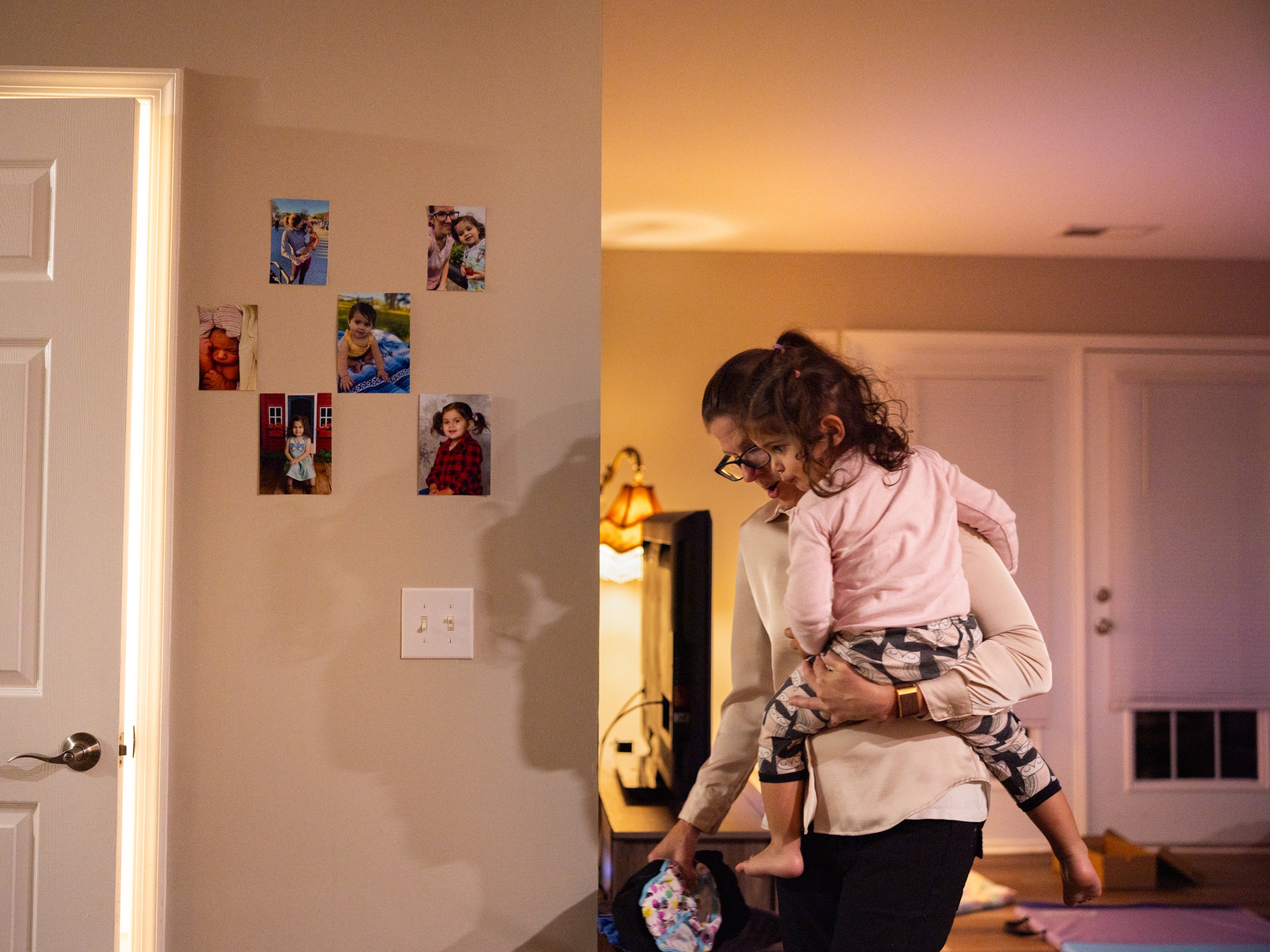 caption: Single mom Adrienne Rumley gets herself and her 2-year-old daughter, Lorelei, ready in the wee hours of the morning in Winchester, Va. Her mornings, days and evenings operate with clockwork precision to fit all the pieces of her life together.