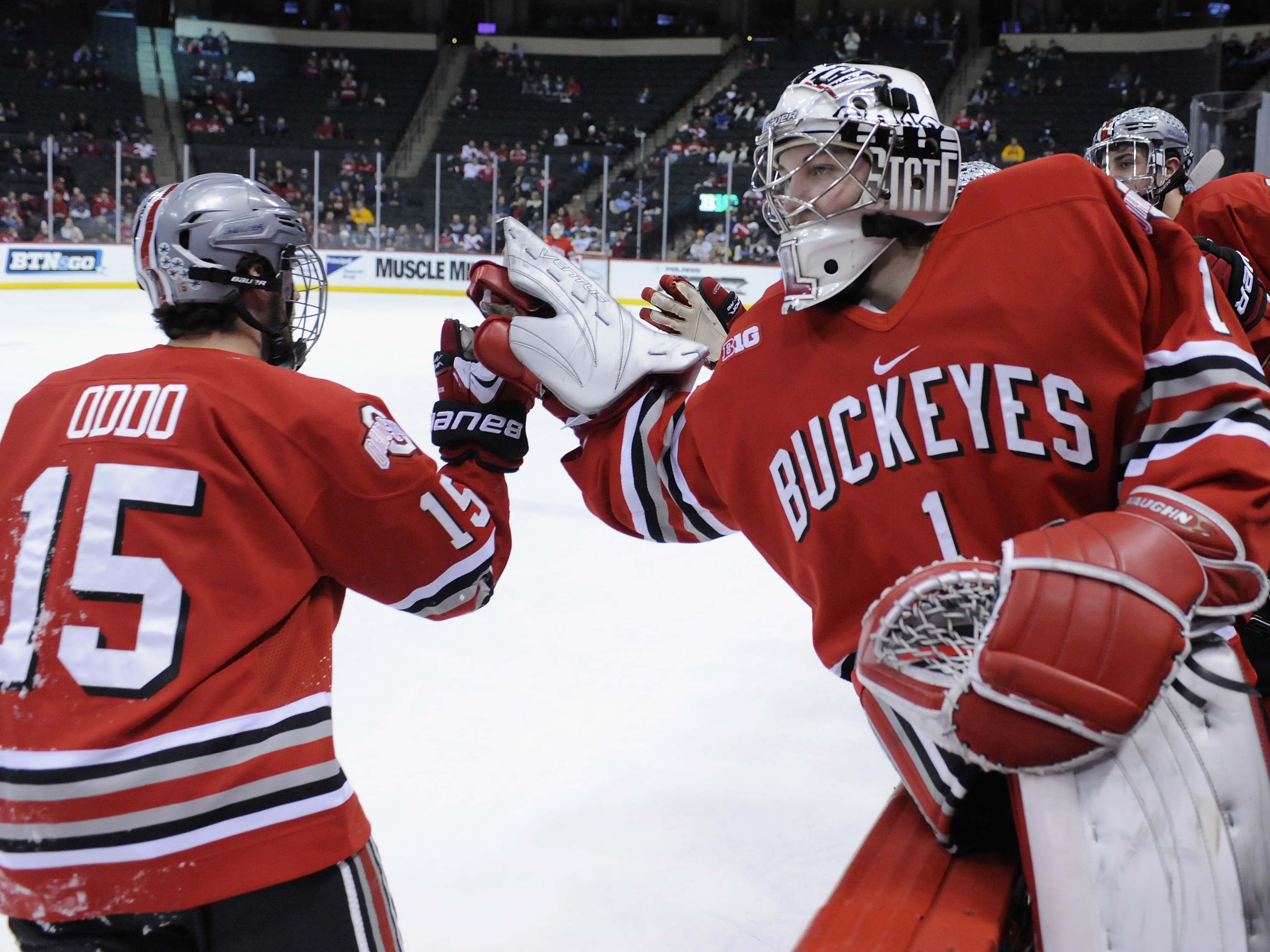 caption: Logan Davis #1 congratulates Ohio State Buckeyes teammate Nick Oddo #15 for scoring a goal on March 22, 2014.