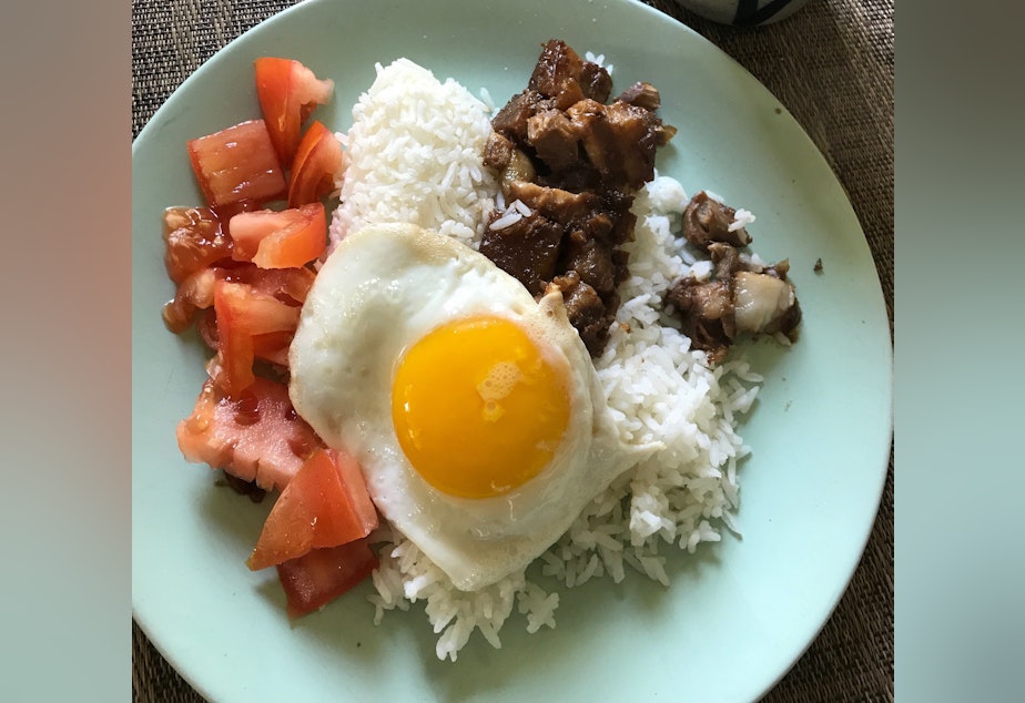 caption: Gracie Santos, front of house manager for the Seattle restaurant Archipelago, has been cooking a lot during the pandemic. This pork adobo is a classic Filipino dish.