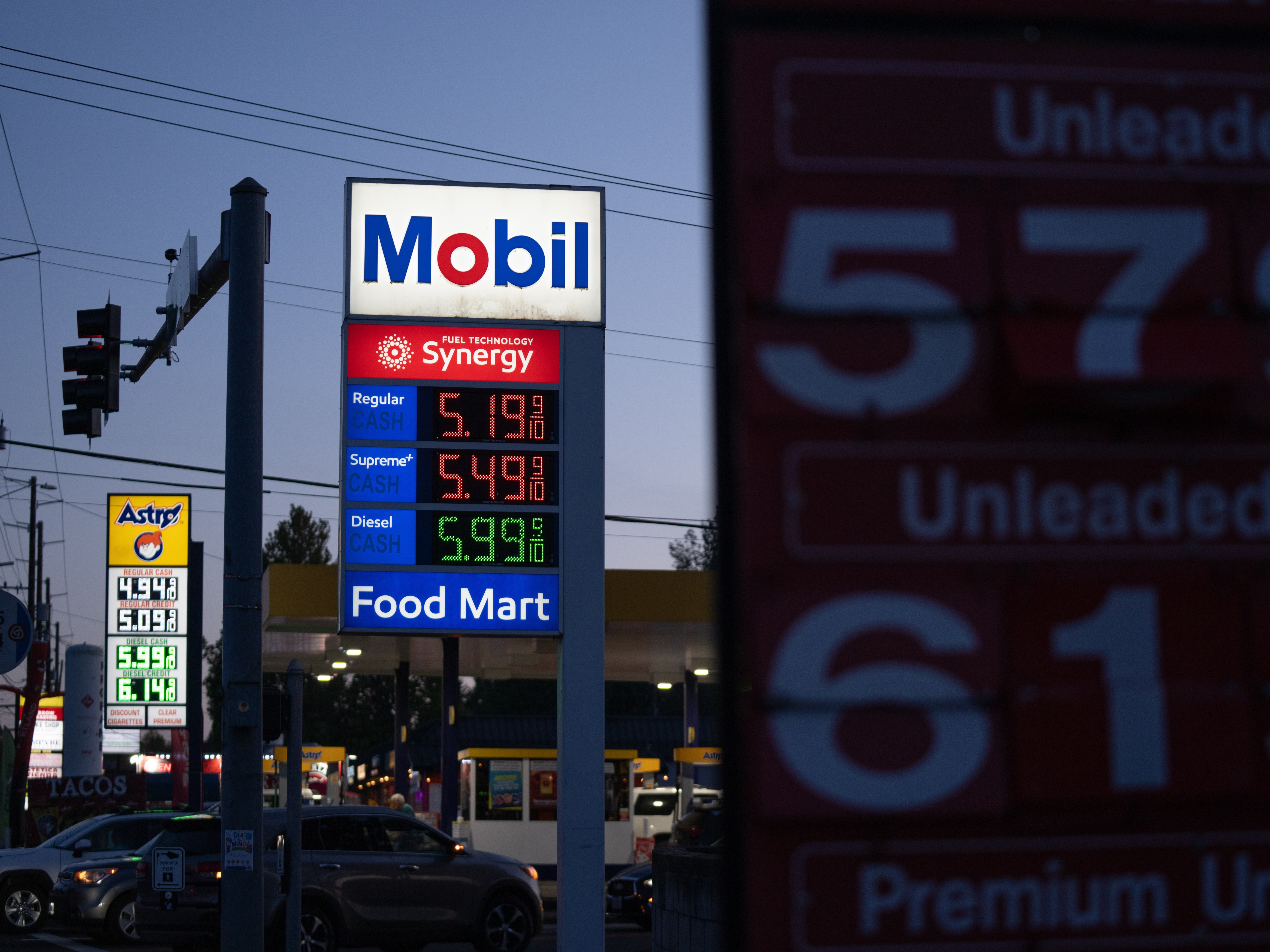 caption: Gasoline prices are displayed at a Mobil gas station on April 29 in Portland, Ore.