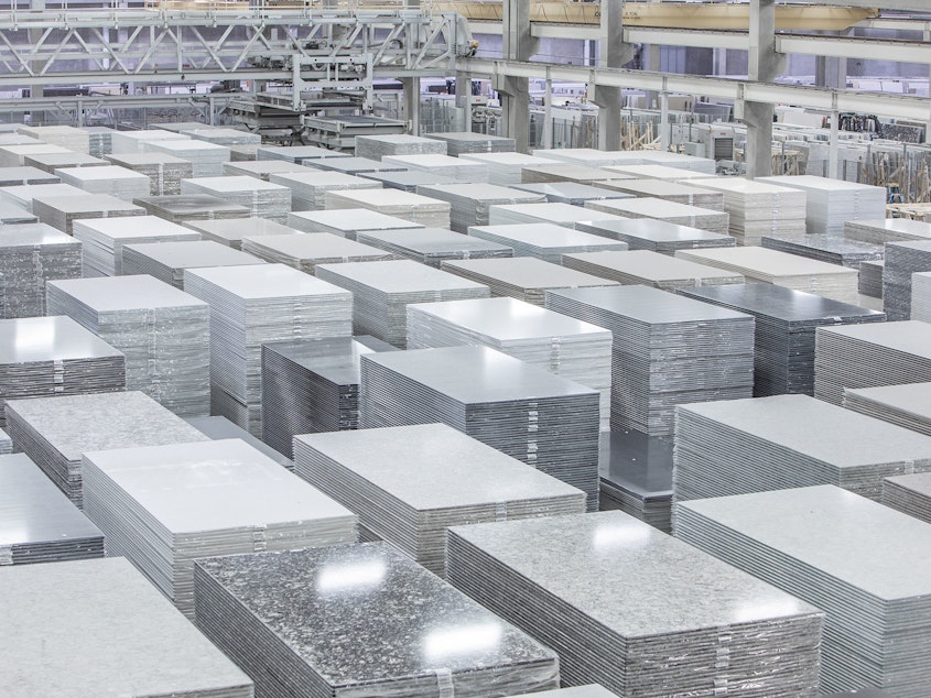 caption: The Cambria factory in Minnesota manufactures slabs of engineered quartz for kitchen and bathroom countertops. If businesses don't follow worker protection rules, cutting these slabs to fit customers'<strong> </strong>kitchens can release lung-damaging silica dust.