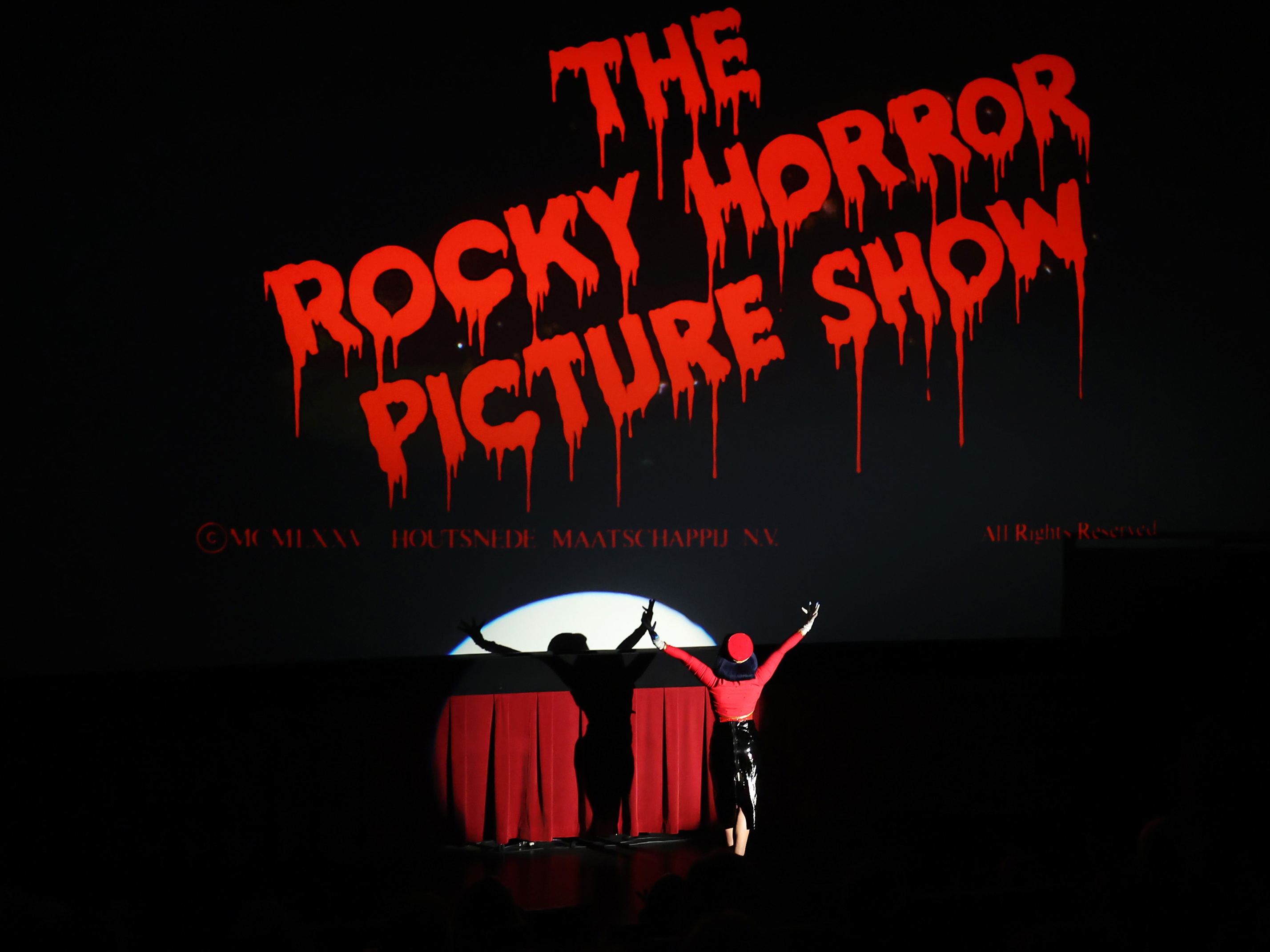caption: "Happy To Be Here" cast member performs during the screening of <em>The Rocky Horror Picture Show</em> during the 2025 TCM Classic Film Festival at TCL Chinese Theatre on April 25 in Hollywood, California.