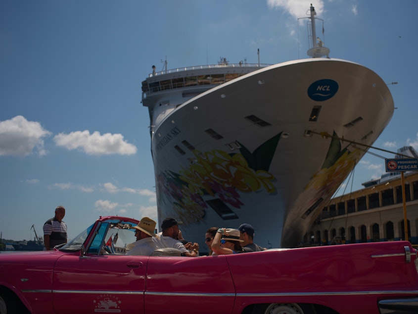 caption: Tourists who have just disembarked from a cruise liner tour Havana on Tuesday. The Trump administration has imposed major new travel restrictions on visits to Cuba by U.S. citizens.