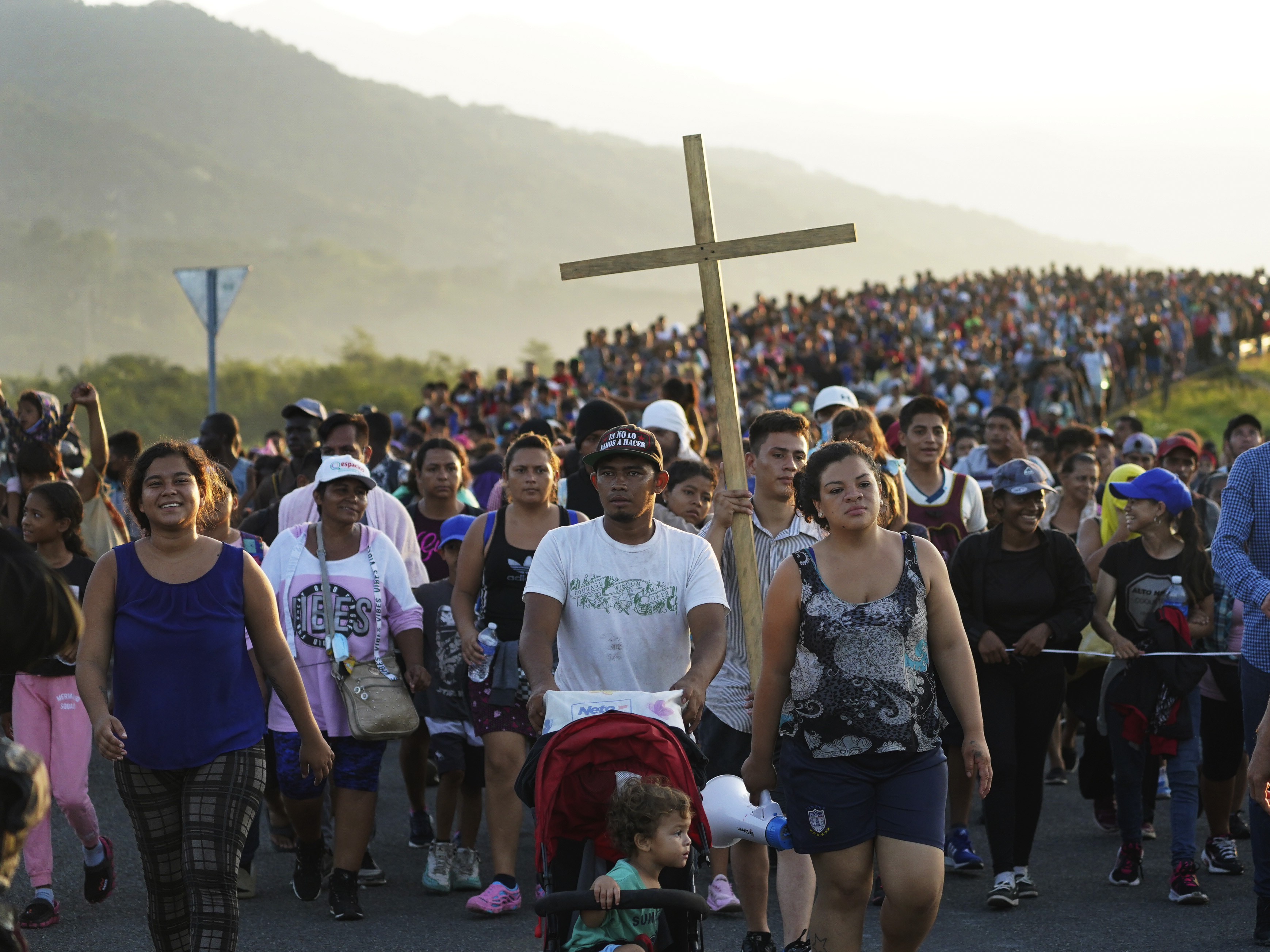 caption: Migrants leave Huixtla, Chiapas state, Mexico, on Oct. 27 as they continue their trek north toward Mexico's northern states and the U.S. border.