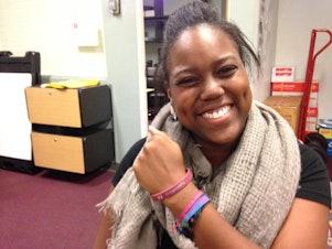 caption: Jasmine Hairston, a senior at Seattle Pacific University, says many students still wear bracelets that say, "Pray for SPU."