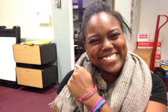 caption: Jasmine Hairston, a senior at Seattle Pacific University, says many students still wear bracelets that say, "Pray for SPU."