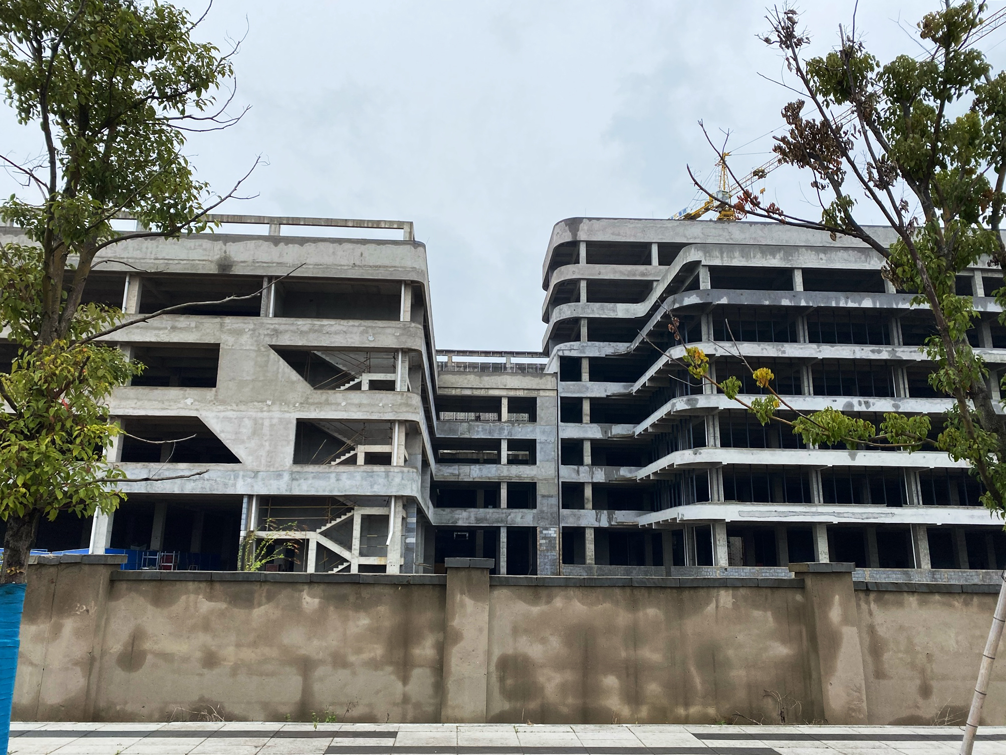 caption: Wuhan Hongxin Semiconductor Manufacturing Co.'s unfinished chip fabrication plant.