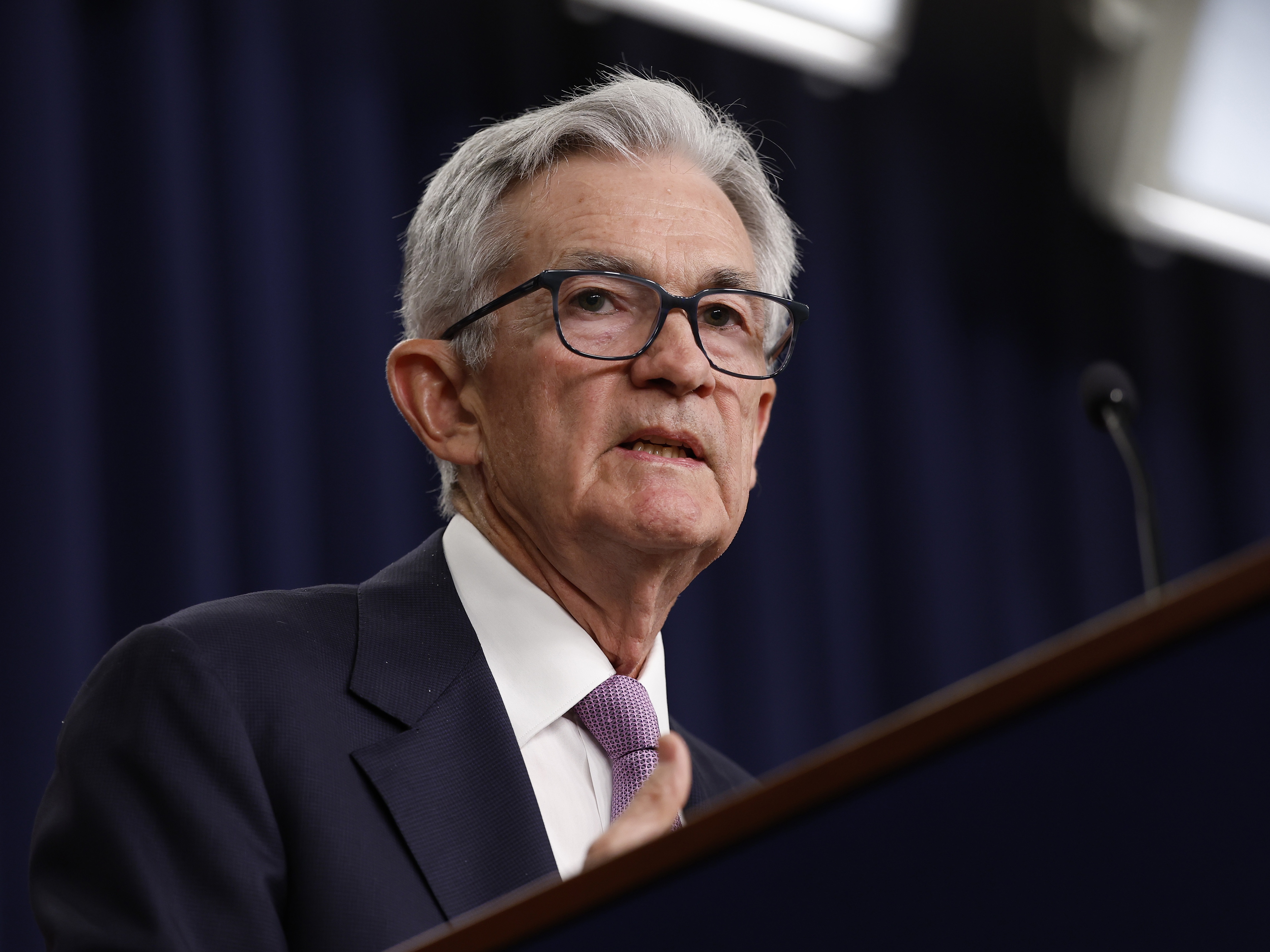 caption: Federal Reserve chairman Jerome Powell and his colleagues lowered interest rates Thursday in response to easing inflation.
