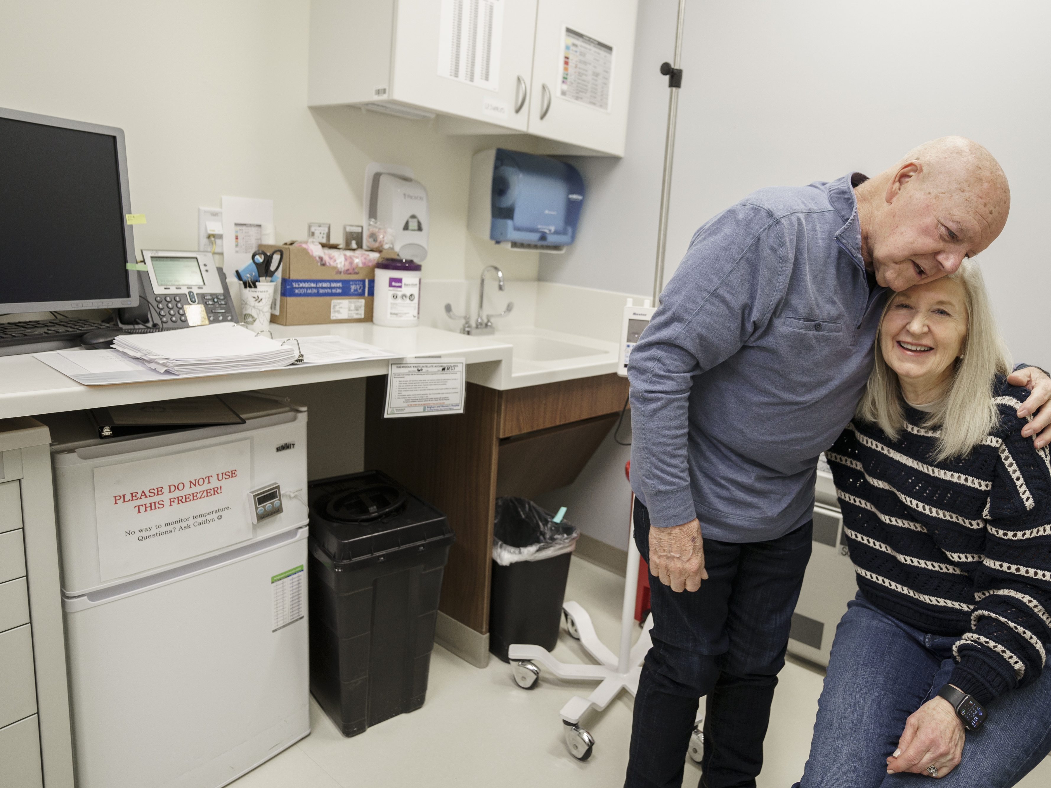caption: Joe Walsh, who has Alzheimer's disease, is accompanied by his wife, Karen Walsh, to an appointment at Brigham and Women's Hospital in Boston. Joe is receiving an experimental therapy to treat Alzheimer's.