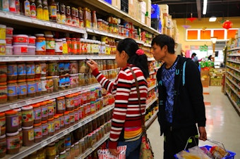 caption: Burmese refugee Tu Tu goes on his first shopping trip in the U.S.