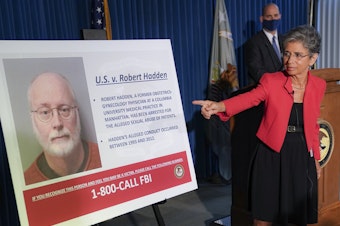 caption: Audrey Strauss, acting U.S. attorney for the Southern District of New York, points to an image of Robert Hadden during a news conference Wednesday to announce his arrest and indictment.
