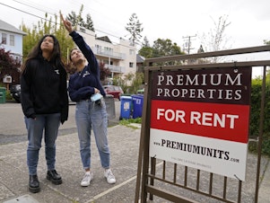 caption: College students Sanaa Sodhi, right, and Cheryl Tugade look for apartments in Berkeley, Calif. in March of this year.