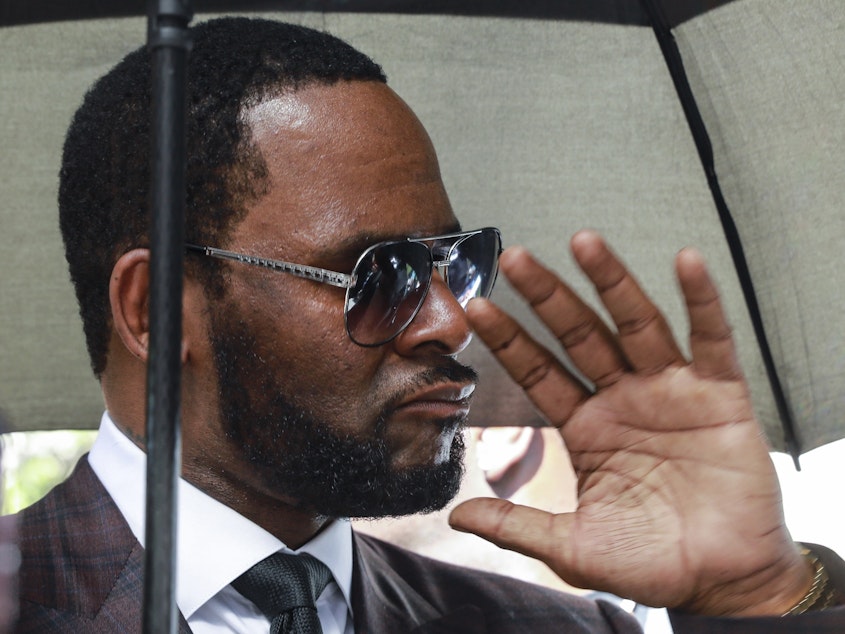 caption: This June photo of R. Kelly shows him departing a courtroom in Chicago in a case related to a state sexual abuse case. On Thursday, federal prosecutors said an additional criminal prosecution against Kelly has been launched.