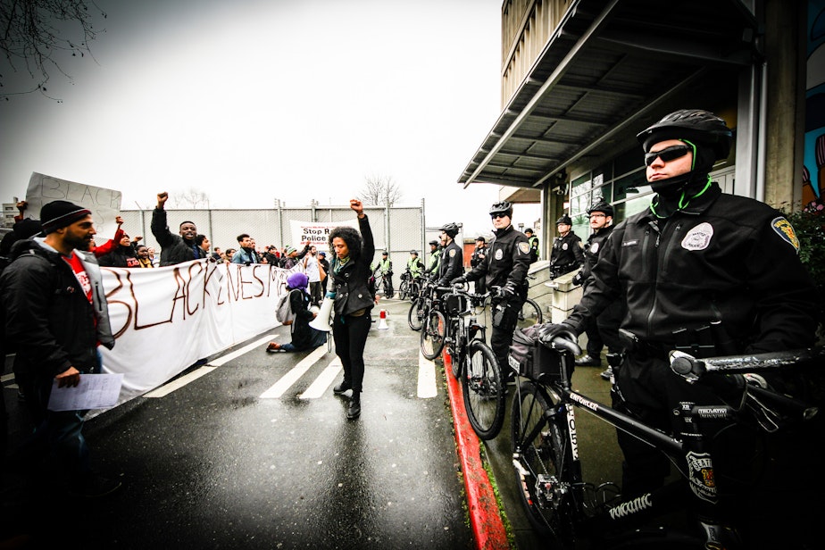 caption: Protest in downtown Seattle protesting police brutality against Blacks in Ferguson and in the Eric Garner shooting on January 10, 2015.