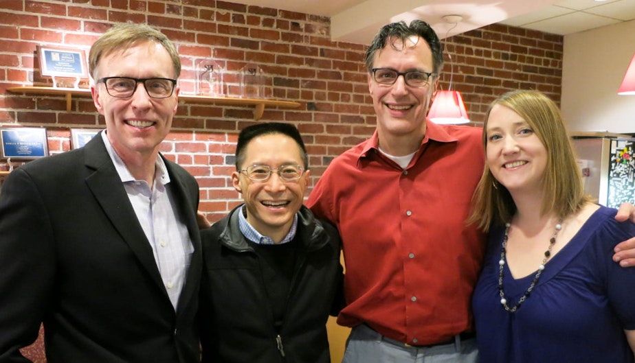 caption: Former Attorney General Rob McKenna, left, writer & activist Eric Liu, host Bill Radke and state Rep. Noel Frame.