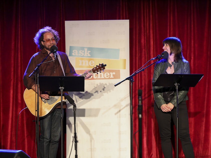 caption: House musician Jonathan Coulton leads a music parody game alongside Ophira Eisenberg on Ask Me Another at the Bell House in Brooklyn, New York