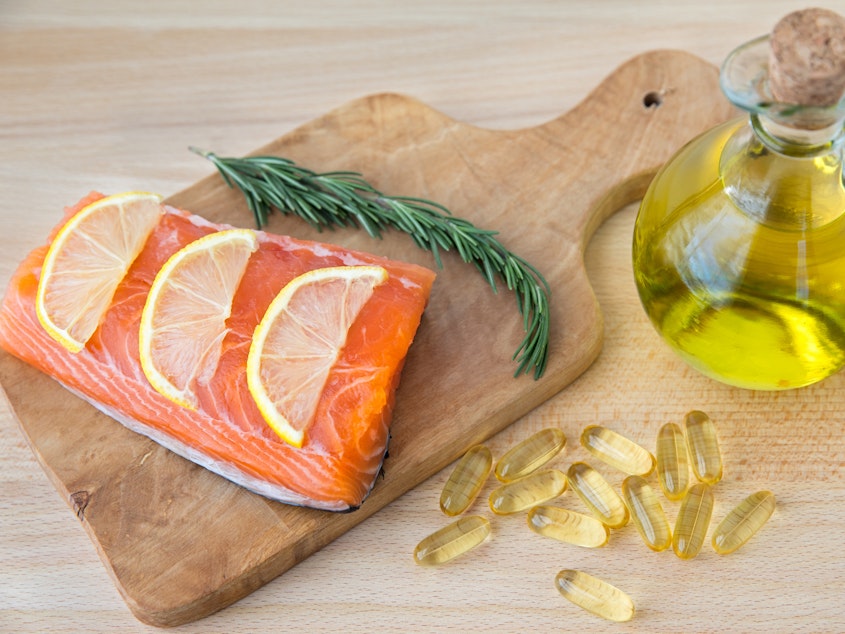caption: Research hasn't delivered a definitive answer on whether fish oil and Vitamin D supplements have health benefits, but it's clear that eating fish is beneficial.