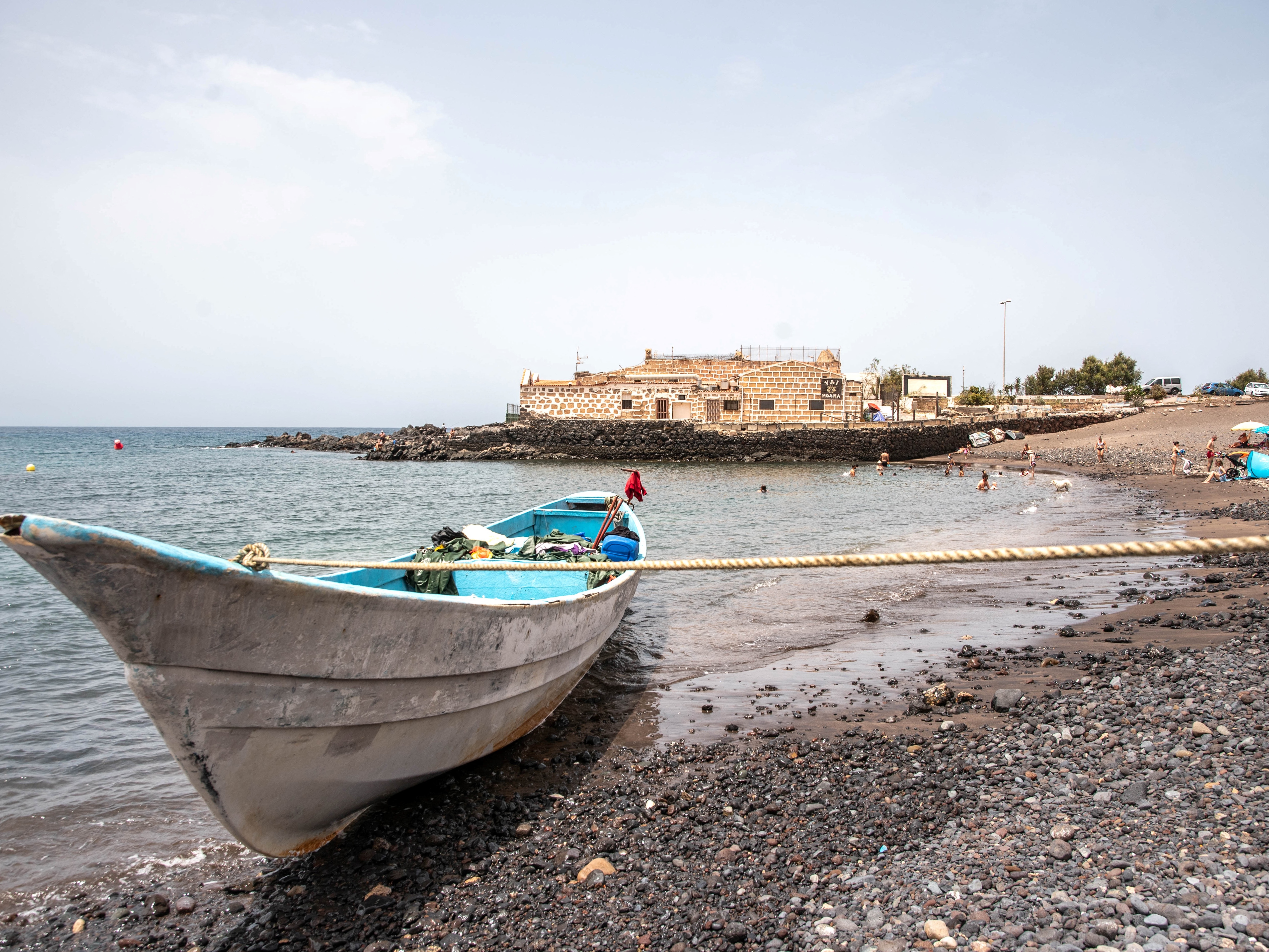 caption: This photograph shows a boat that arrived with 41 people on board, including two minors, on the Canary island of Tenerife in July 2023.