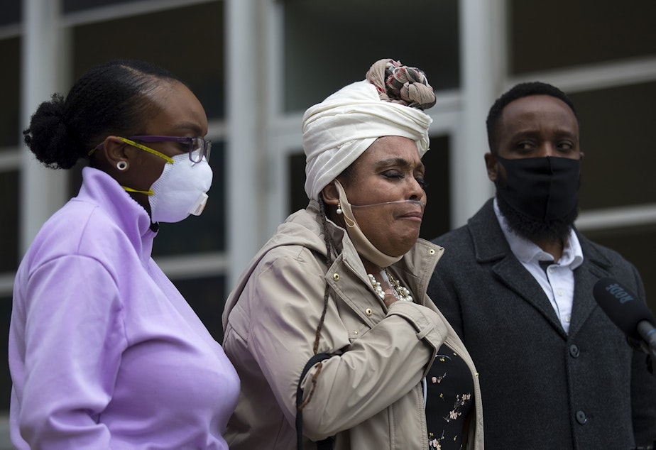 caption: Marcia Carter-Patterson speaks to the press with her two children, Monet Carter-Mixon, left, and Matthew Ellis, right, regarding the March 3rd police killing of her son, Manuel Ellis, on Thursday, June 4, 2020, outside of the Pierce County Superior Courthouse in Tacoma. "Manny was taken from me," said Carter-Patterson. "He was murdered. I cried for two months and ten days." 