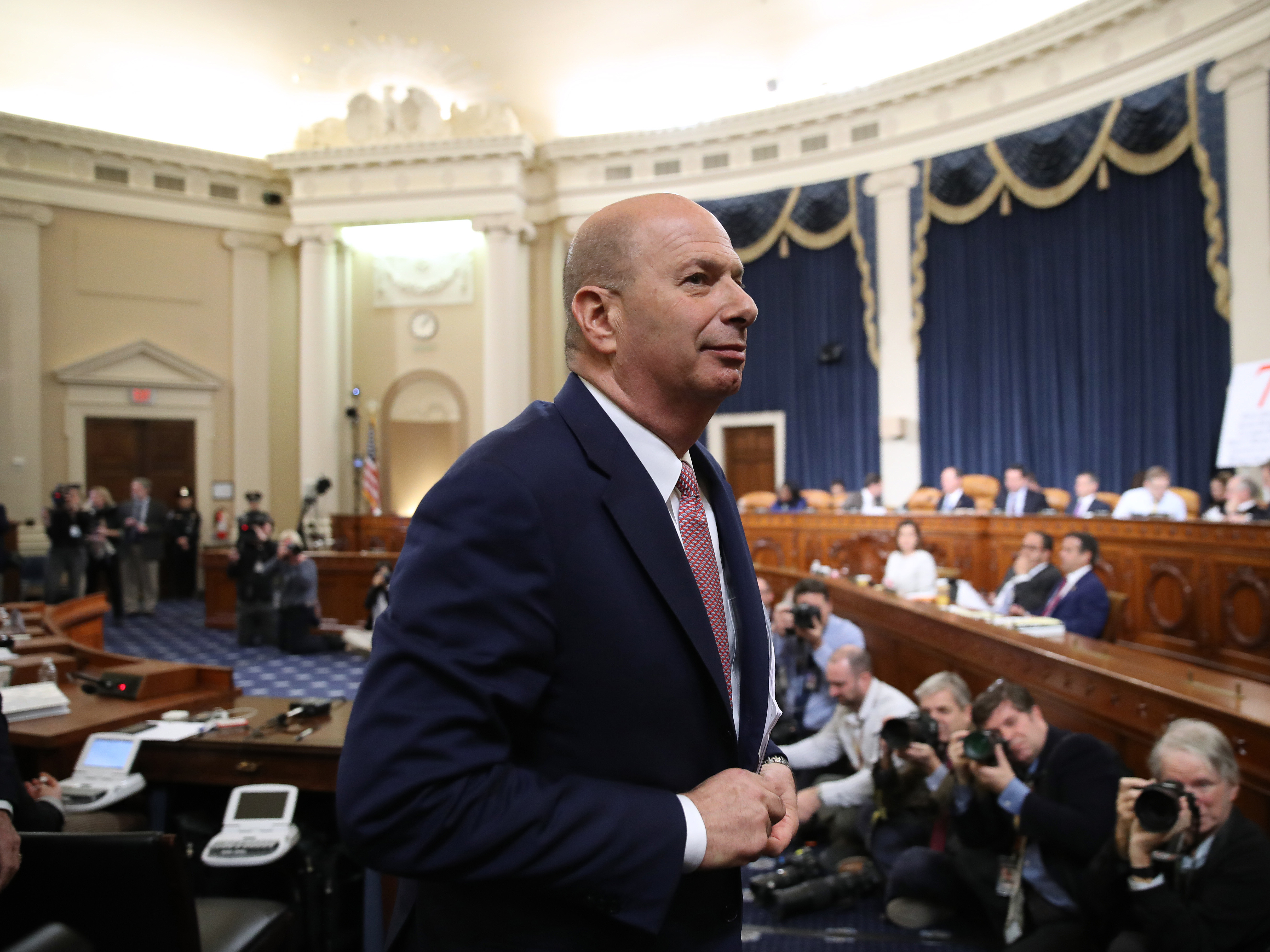caption: Gordon Sondland, the U.S ambassador to the European Union, departs for a short break while testifying before the House Intelligence Committee in the Longworth House Office Building on Capitol Hill on Wednesday.